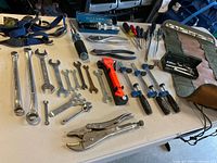 Overview of all hand tools laid out on table