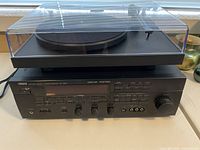 Front view of Yamaha RX-V690 receiver with Pro-Ject Debut III turntable stacked on top