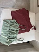 Overhead view of both crop tops showing colors, styles and straps