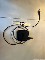 Front view Apple TV, remote, power cord