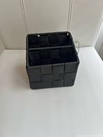 Top view of square woven pen holder showing compartments