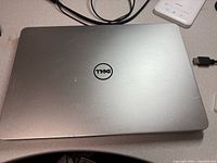 Closed silver Dell laptop top cover
