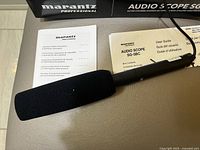 Microphone with foam windscreen, integral cable and user guide