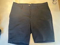 Front view of dark navy golf shorts