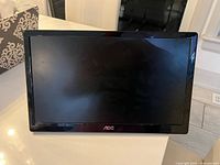 Front view of AOC LCD monitor showing screen and logo