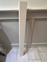 Front view of white Ikea shelf upright