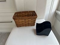 Wicker basket and black desk organizer displayed side by side