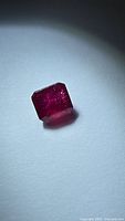 Front angled view of octagon-cut ruby