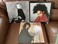 Front covers of all three albums displayed