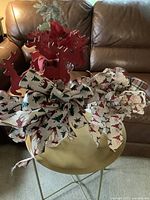 overview of ribbon bows and wood reindeer picks on table