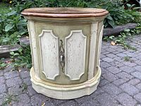 Front view of painted drum table showing door and hardware