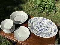 Overall view showing Blue Nordic platter, stack of Athena plates, separate plates