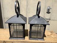 Front view of both lanterns showing design and condition