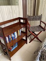 Bookcase and director’s chair shown side by side