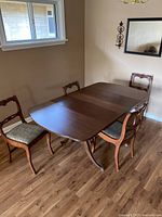 Table fully extended with two chairs visible