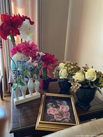 Overall view showing all silk flower arrangements and framed artwork