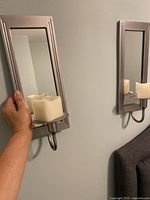 Wall candle sconce shown mounted with pillar candle