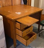 Front and left side showing drawers open and slide-out tray