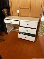 Desk front with drawers partly open showing interior