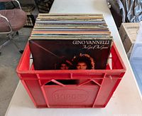 Crate with stack of vinyl LP records
