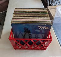 Front view of crate with stacked LP records