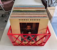 Front view of crate filled with records, George Benson LP at front