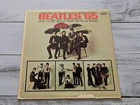 Front of Beatles '65 sleeve with band photo and song list