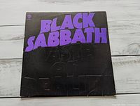 Front of album jacket showing title graphics