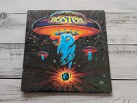 Front cover showing Boston spaceship artwork