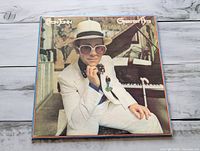 Front album cover with Elton John photo