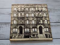 Front of gatefold jacket showing building facade design