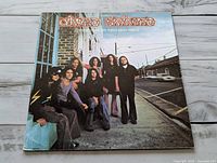 Front cover showing band photo and album title