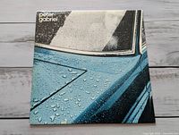 Front sleeve showing blue car artwork