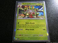 Front of Hydrapple holographic card in sleeve