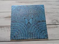 Front cover showing blue butterfly artwork