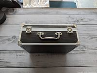 Closed case front view showing handle and latches