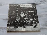 Front cover displaying band photo and title