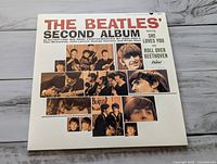 Front album cover showing title and band photos