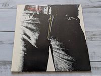 Front sleeve showing jeans image and working zipper