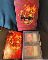 Overall lot showing Molten Core slipcase, rulebook, binder and card pages with World of Warcraft cards