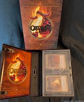 Onyxia's Lair Raid Deck packaging opened to show booklet and two card boxes