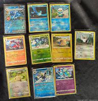All ten Pokémon holographic cards laid out