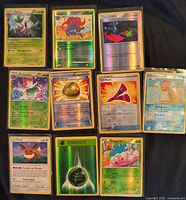 Image showing all ten reverse-holographic Pokémon cards fanned out for identification
