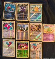 All ten holographic Pokémon cards laid out in three columns