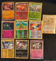 All ten holographic Pokémon cards laid out in three rows showing fronts and foil finishes