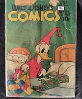 Front view of Walt Disney’s Comics and Stories #67 showing cover art, bag and board