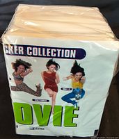 Shrink-wrapped stack of Spice Girls Movie sticker cards showing front cover artwork with Victoria, Mel C, and Mel B