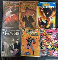 Front covers of all six DC comic books laid out