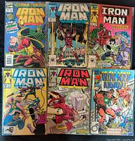 Front covers of all six Iron Man comics in protective sleeves