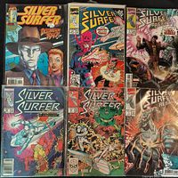 Group shot of six Silver Surfer comic books arranged in two rows showing full front covers